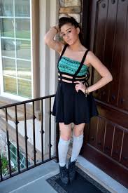 Full length photo of charming woman holding dessert smiling wearing denim jeans jacket. Knee High Socks And Converse Pasteurinstituteindia Com