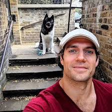 henry cavill and his dog kal. he has said several times that kal saved his  life several times when experiencing a declining mental health.