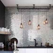 The textured reflective surface of this stainless steel backsplash changes with the intensity and direction of the light for a modern organic design. 6 Kitchens With Metal Tile Backsplashes That Gleam Hunker