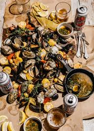 Ingredients · 8 medium red potatoes, scrubbed · 1 pound clams in shell, scrubbed · 1 pound mussels, cleaned and debearded · ½ pound unpeeled large shrimp · 1 (48 . Grilled Summer Clambake With Herbed Garlic Butter Edible Boston