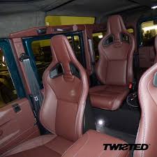 a really unique spec this twisted customer chose to add two recaro seats in the middle of the 110 framework optimum comfor recaro seating land rover defender