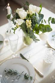 Choose a placemat that matches your plates and looks nice on your tabletop as well. Beautiful Festive Table Setting With Elegant White Flowers And Stock Photo Picture And Royalty Free Image Image 117232310
