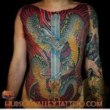 Japanese Dragon Tattoo With Sword And Fire On Chest And Stomach In Color Tattoo Done By Diego Dragon Tattoo With Sword Japanese Dragon Tattoo Japanese Dragon