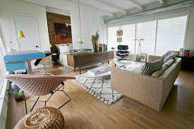 In the space shown here, a daybed plumped up with lots of cushions serves as a sofa for watching tv or as a bed for overnight guests. It Can Work When Your Living Room Is Your Bedroom