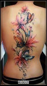 Butterfly And Flower Back Tattoo Tattoo Shortlist Tattoos Lily Flower Tattoos Butterfly Tattoo Designs