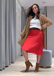 You may look for various tailored cuts for the camel coats to upgrade your wardrobe? Sydne Style Shows How To Wear A Red Skirt With White Sweater And Camel Coat From Ann Taylor Sydne Style