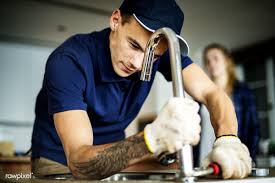 A clogged kitchen sink is a common plumbing problem that can be quite disruptive. Download Premium Image Of Plumber Fixing Kitchen Sink 387096 Kitchen Sink Plumber Plumbing