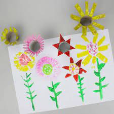 First, cut fringe at one end of your toilet roll then make a little pool of paint, either on a plastic plate or on a piece of foil and start dipping and stamp painting the beautiful dandelions. Easy Flower Craft With Tp Roll Stamps Emma Owl