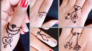 This is a mehndi tattoo of alphabet 't'. 5 Beautiful M Letter Rings Design With Mehndi Stylish And Elegant Fing In 2021 Mehndi Designs For Fingers Simple Mehndi Designs Fingers Mehndi Designs For Hands