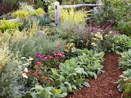 Raised bed garden with hoop house attachments. 4 Easy Care Flower Bed Ideas Sunset Magazine