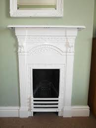 20 Beautiful Fireplaces For A Small Living Space Cast Iron Fireplace Small Fireplace Fireplace