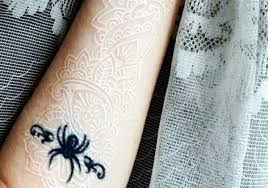 Garter tattoo with pink bow and heart jewel. 101 Tasteful Lace Tattoos Designs And Ideas
