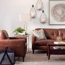 Leather accessories for the home are a classic and they go with everything. Decorating With Brown Leather Furniture Tips For A Lighter Brighter Look Schneiderman S The Blog Design And Decorating