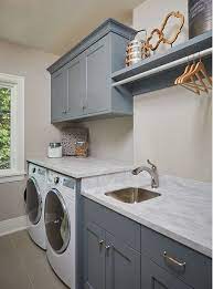 Instead of taking up floor space with a standing drying rack, designer dina bandman installed a custom lucite rod between two upper cabinets in this san francisco laundry. Pin On Home Decor Ideas