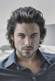 Black Curly Hair Medium Length Hairstyles For Men Blue Shirt Blue Eyes Long Hair Styles Men Mens Hairstyles Medium Medium Hair Styles