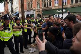 Police officers injured as far-right activists face off against anti-racism  groups across U.K.