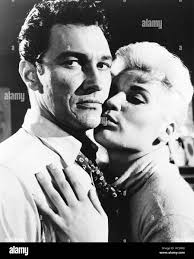 THE SCAMP, (aka STRANGE AFFECTIO), from left: Terence Morgan, June  Cunningham, 1957 Stock Photo