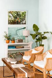 It's made with a white finished aluminum frame, and has a squared off silhouette with a woven design on the seat arms and back for a breezy feel. 19 Best Rattan Chairs For Every Space In Your Home
