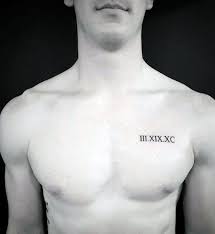 Roman Numerals Tattooed In Black On The Left Hand Side Of A Slim And Athletic Man S Chest Meaningful Chest Tattoo Men Small Chest Tattoos Cool Small Tattoos
