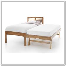You can hide the extra mattress underneath the bed frame during the day, but then pull it out when it's in use. Trundle Bed Frame Ikea Pop Up Trundle Bed Murphy Bed Plans Modern Murphy Beds