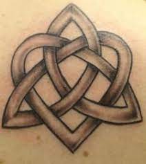 A women inked with celtic trinity tattoo and a circle intermingled with rose flowers and vine. 25 Best Celtic Heart Tattoos Ideas Tattoos Celtic Heart Celtic Heart Tattoo