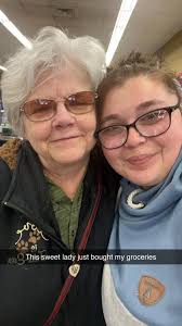 Woman pays for groceries at Piggly Wiggly in Waupun