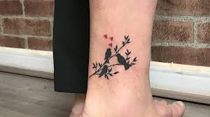 Meaningful Simple Birds On A Branch Tattoo 40 Meaningful Tattoos Parents Got To Honor Their Kids Tattoos For Kids Bird Tattoo Wrist Tattoos