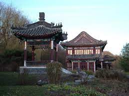 You will find the tram stop at the bridge, which crosses the main train station. China Haus 03 Mapio Net