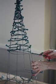 17 Apart Diy Tomato Cage Christmas Tree Lights Tomato Cage Christmas Tree Diy Christmas Lights Decorating With Christmas Lights