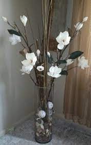 Artificial flower arrangements make great gifts all year round! Faux Flower Arrangement With Potpourri Filler Floor Vase Decor Glass Vase Decor Faux Flower Arrangements