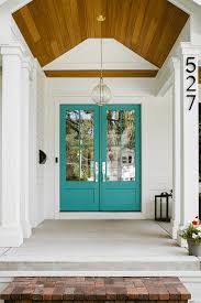 Exterior Shot Of A Modern Farmhouse With A Double Turquoise Entry Door White Farmhouse Exterior Modern Farmhouse Exterior Modern Farmhouse Porch