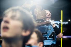 Lansing Catholic football feasts