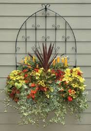 20 Creative Outdoor Wall Decor Ideas Wall Trellis Garden Wall Garden Containers