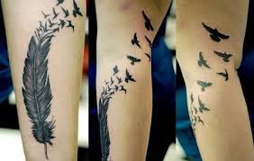 Feather With Birds Flying Away Tattoo Bird Tattoos For Men Feather Tattoo Meaning Feather With Birds Tattoo Feather Tattoo Design