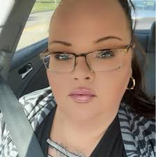 Blonde woman in camo jacket spotted in parking lots