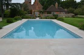 Outdoor Pool With Fossil Pearl Tumbled Limestone Coping Stones And Paving Cranbournestone Outdoor Pool Fossilpearl Limes Swimming Pools Pool Modern Pools