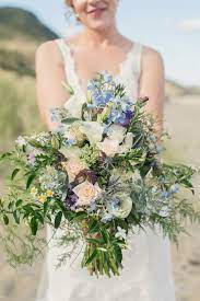 A Wild Blue Bridal Bouquet For A Beach Wedding Bridal Bouquet Blue Red Bouquet Wedding White Wedding Bouquets