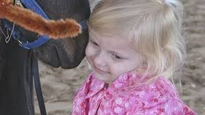 Little cowgirl captures hearts of community