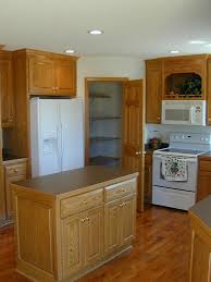 The manufacturer i deal with make a matching small crown molding for just such an occasion, it has a 5/8 tail that tucks in over the cabinet and the crown overlaps. Open Kitchen With 42 Upper Cabinets Walk In Pantry Cocinas