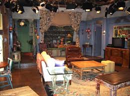 The living room has large windows and an interesting design. Friends25 Behind The Scenes In Monica S Apartment