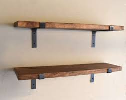 Create a functional wall space with these wall hanging shelves while you establish a unique home decor that will impress your guests. Fixer Upper Shelves Etsy