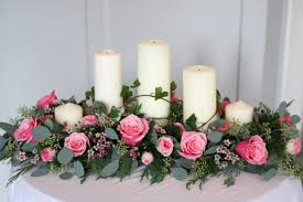 Top Table Arrangement With Roses Spray Roses Wax Flower Eucalyptus And Ivy Church Pillar Candle Table Flower Arrangements Flower Decorations Flower Candle
