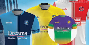 The chairboys' 13/14 home jersey uses wycombe's trational quartiles in the club's light blue and black on its front torso. Wycombe Wanderers 20 21 Championship Home Away Third Insane Goalkeeper Kit Released Footy Headlines