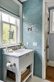 An effective bath panel idea to conceal the surround is to incorporate it into your tiling scheme. Guest Bath Of The Southern Living 2019 Idea House Featuring Bath Cabinet And Door Hardware By Emtek Pool House Bathroom Southern Living Homes Small Bathroom