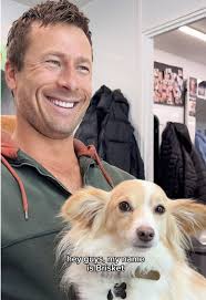 Dog in Raincoat Glen Powell