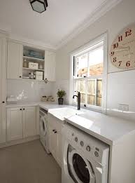 Suzie Porchlight Interiors Clean Open Laundry Room Design With Ivory Ikea Kitchen Cabinets Laundry Room Design Ikea Laundry Room Laundry Room Inspiration