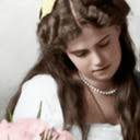 What was the hair/eye colour of OTMA? From whom did they inherit those  traits? It's really hard to imagine when there's only b&w...