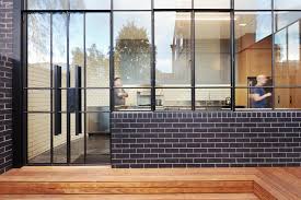 Light comes through them, but you cannot see through them. Black Brick Walls Wrap Around The New Addition To This Home