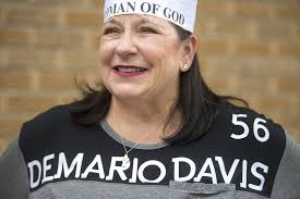 Photos, video: With their own 'Child of God' headbands, New Orleans  students back Saints' Demario Davis