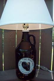 An empty bottle, teflon tape, copper top plate connector, split ring hanger, copper coupling, copper cap, hex nuts, wood screws, a threaded rod. Recycled Diy Bottle Lamps Recyclart Diy Bottle Lamp Bottle Lamp Beer Bottle Lamp